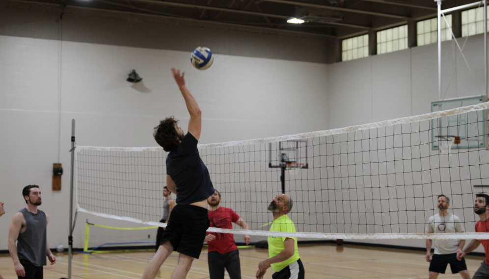 A student spikes the ball