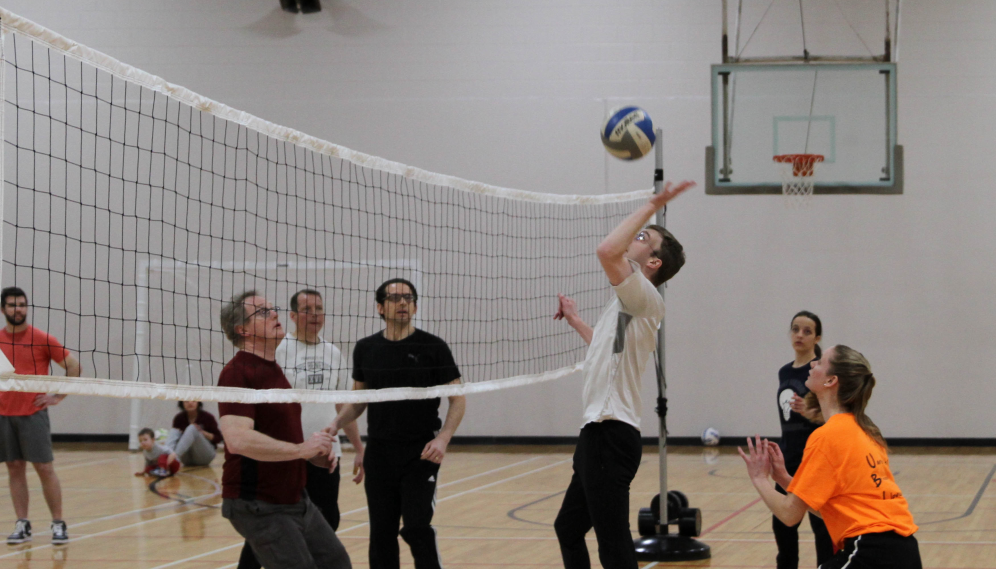 A student sends the ball over