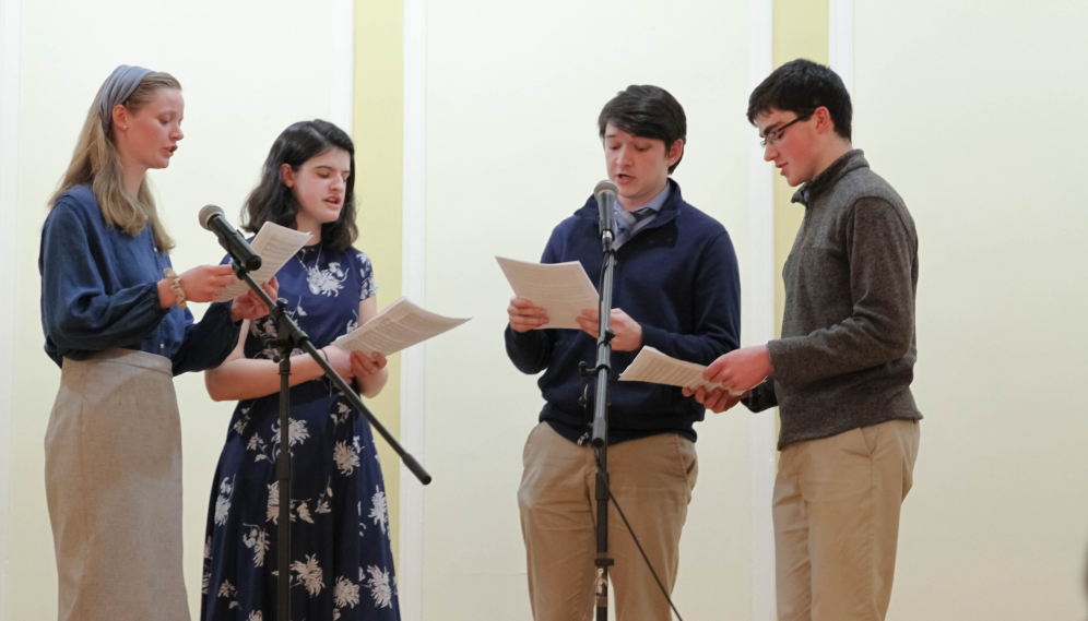 A quartet perform a capella