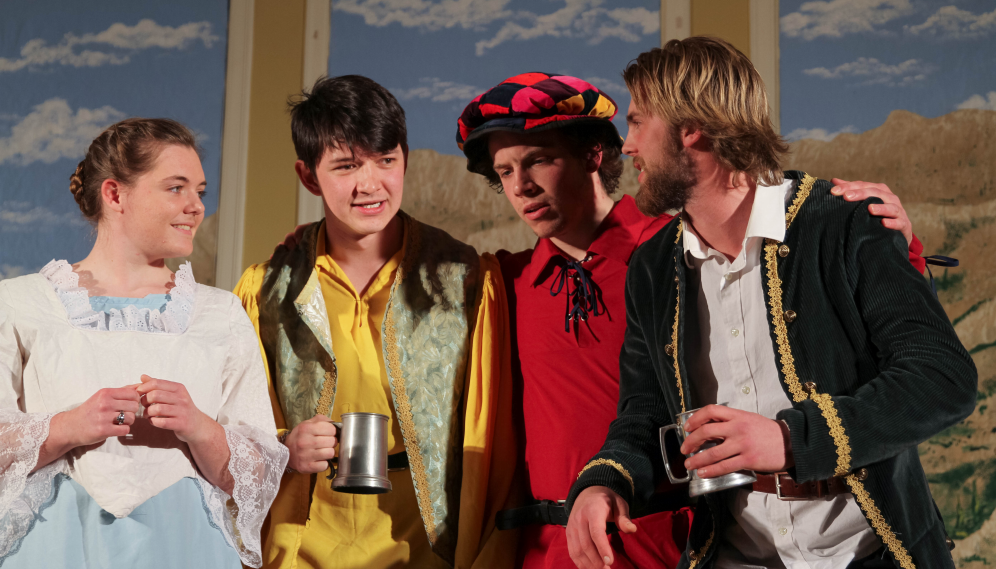 The red- and yellow-clad men together with the sailor and the girl in white and blue