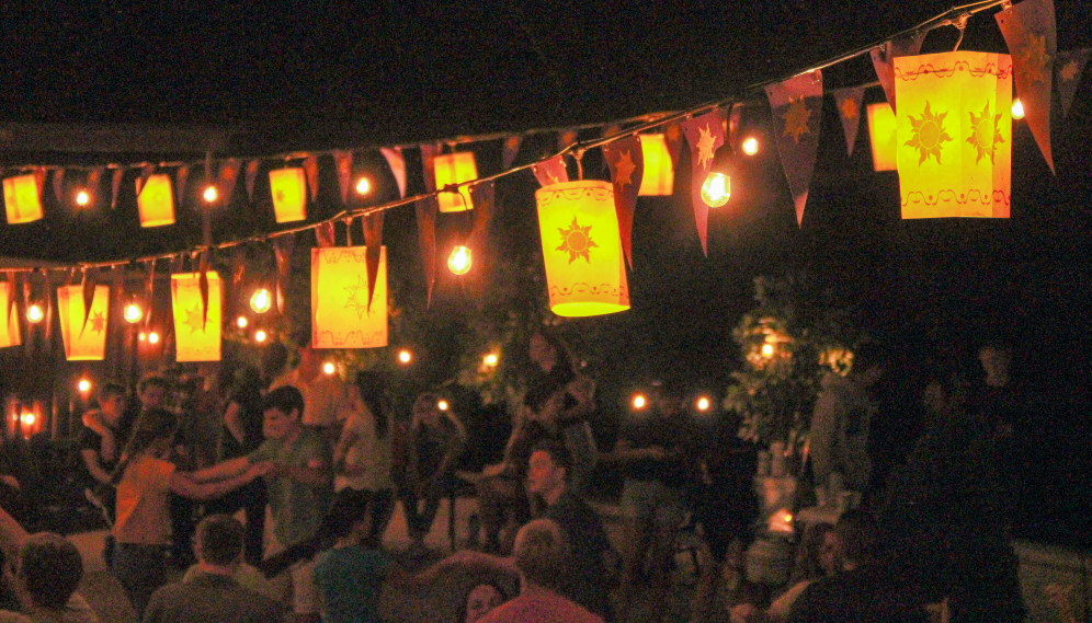 Paper lanterns lit over the dance