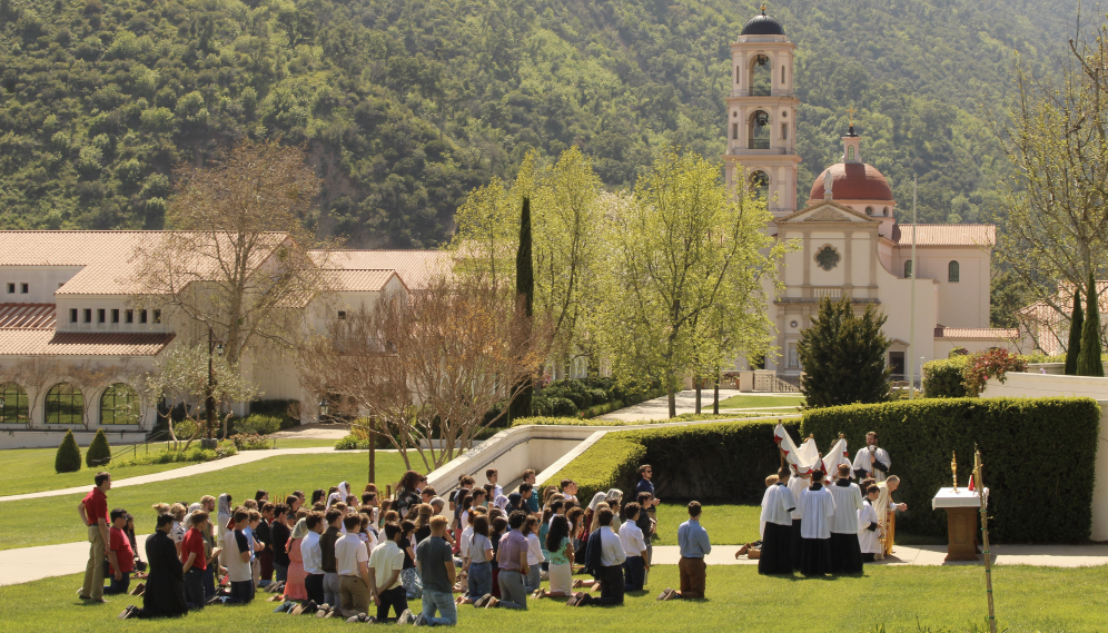 Long shot of the kneeling congregation and the temporary altar