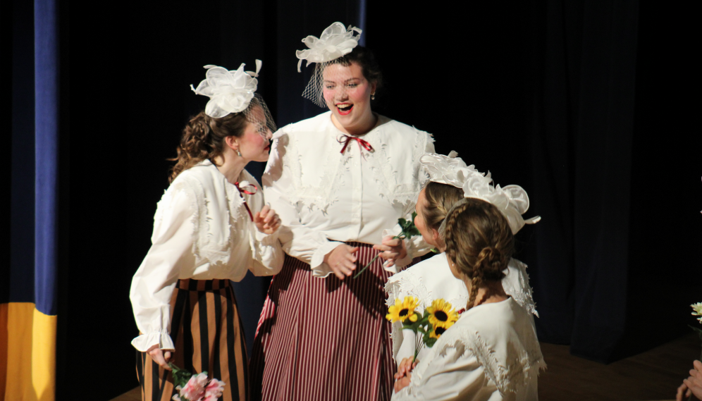 Four ladies with floral hats