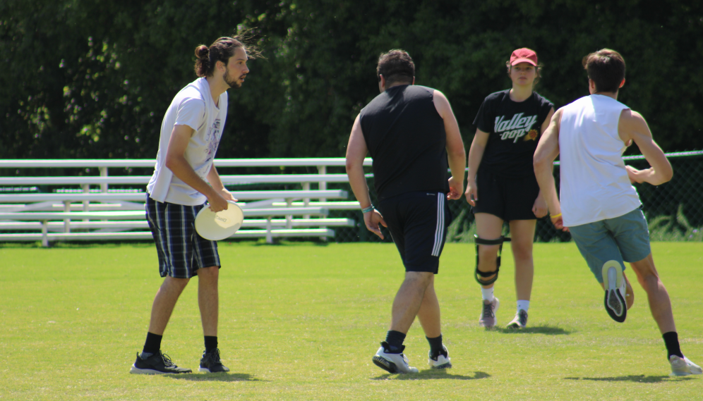A student holds the Frisbee