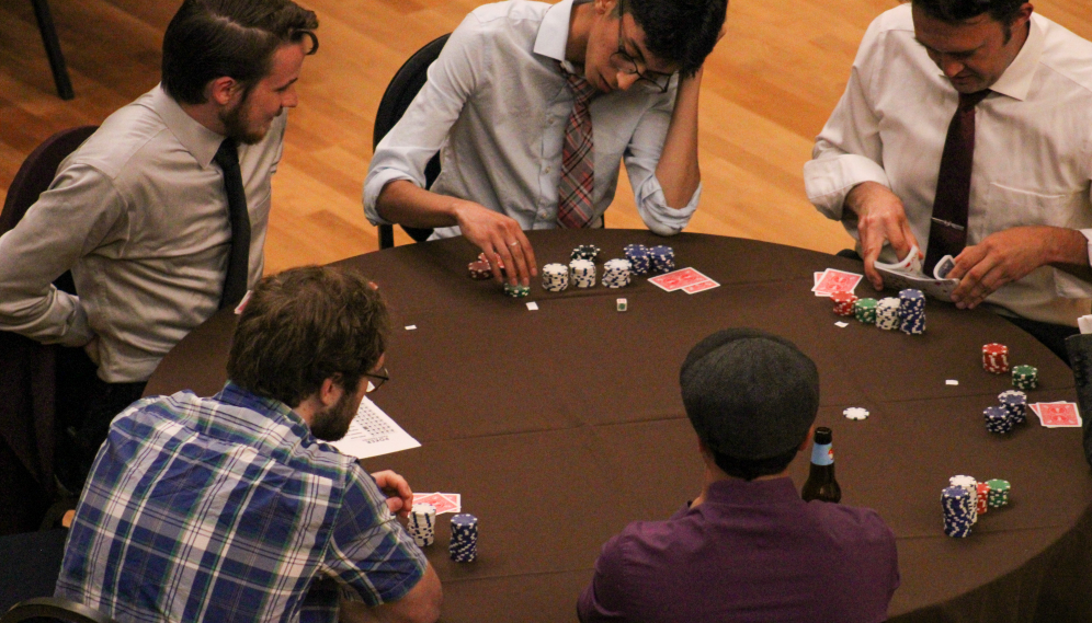 Poker players at one of the tables