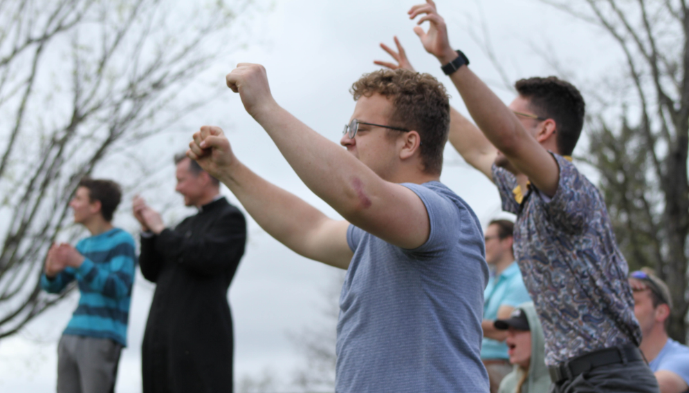 Onlookers cheer and applaud