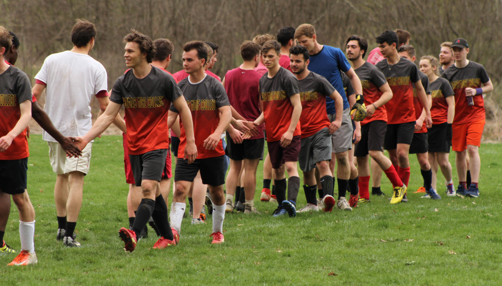 The teams shake hands