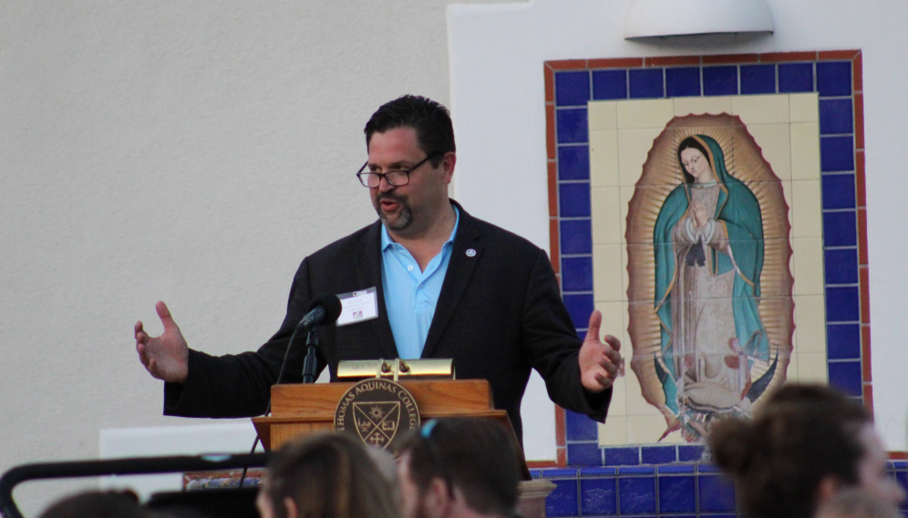 An alumnus gives a speech