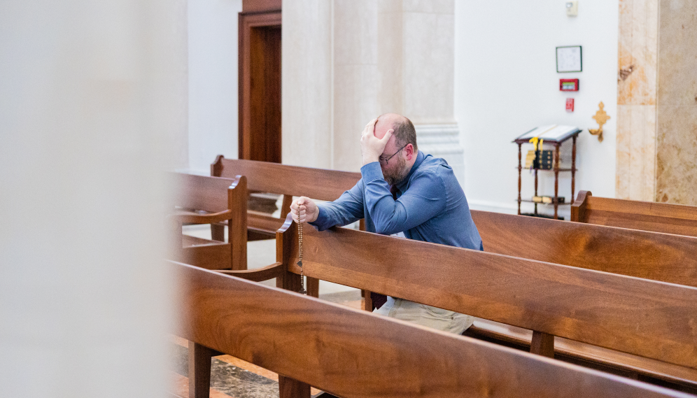 A student prays the Rosary