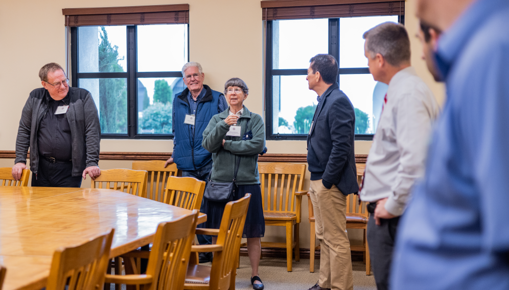 Six chat in a classroom