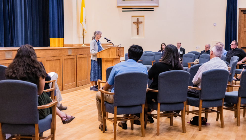 A scholar presents her work