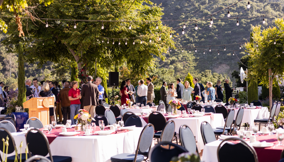 The attendees gather for dinner on Gladys Patio