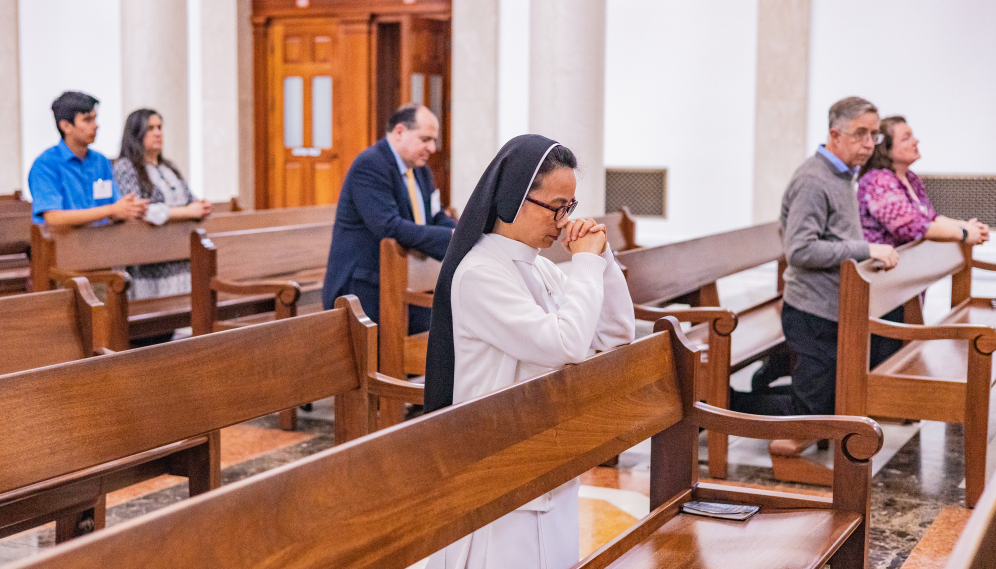 Attendees pray in the Chapel