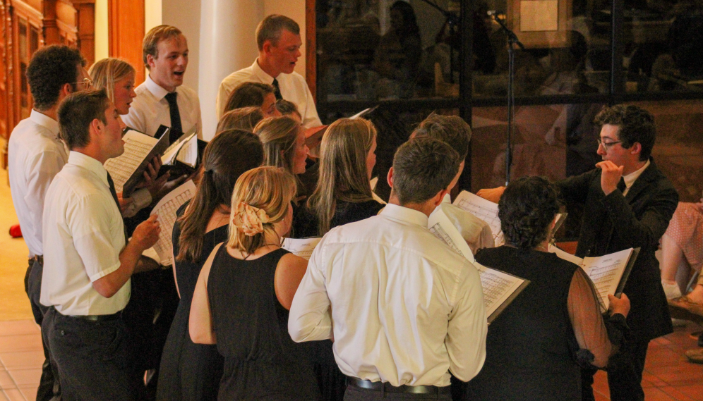 A view from one side as the whole choir performs