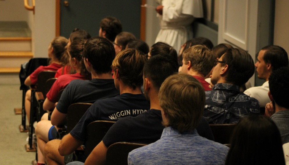 Students listen to the admissions director