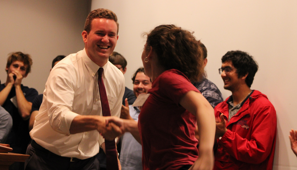 John Jost shakes hands with a prefect