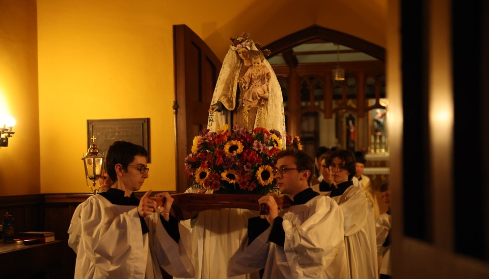 The procession reaches the back of the chapel