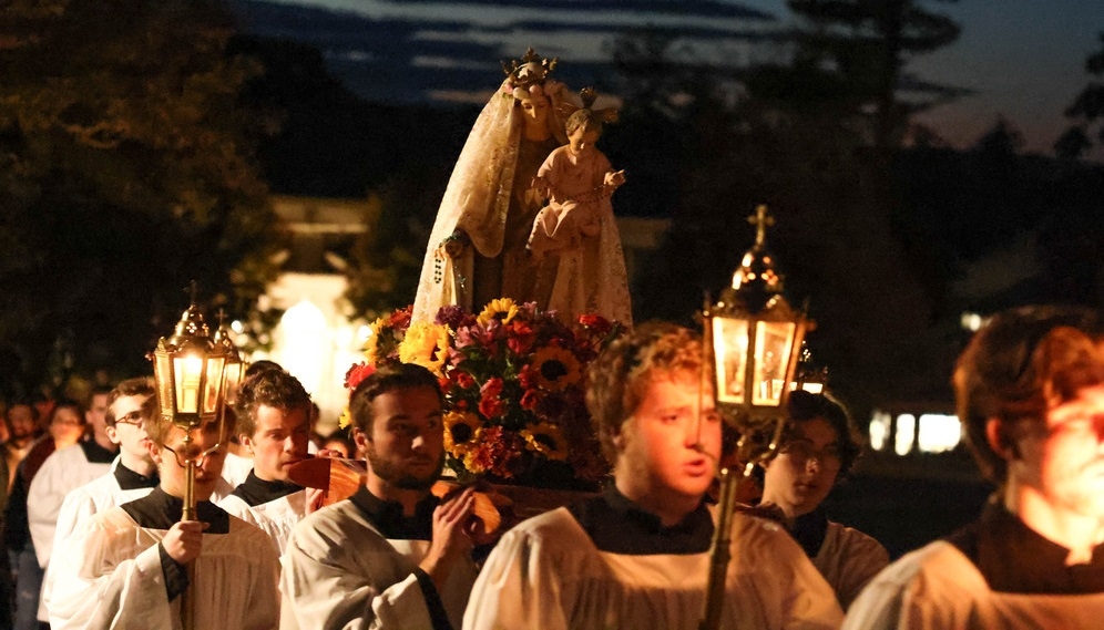 The procession continues along the main campus road