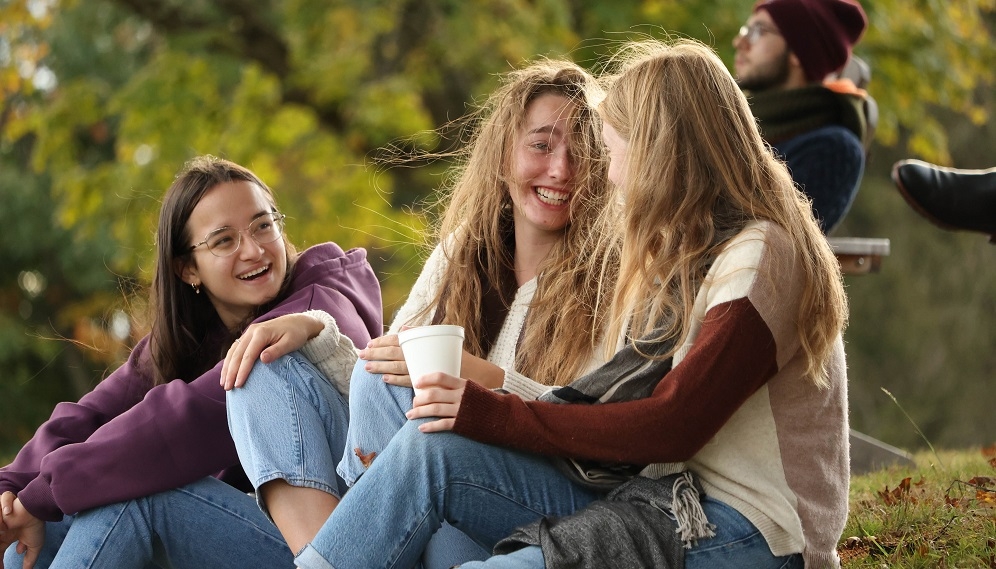 some juniors relax on the hillside