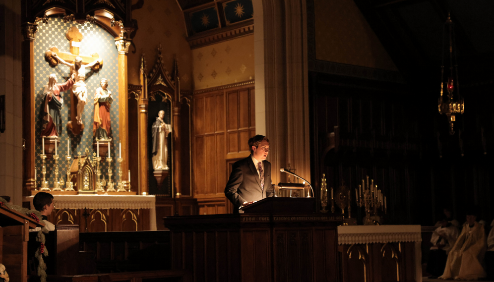 Will Claeys ('27) reads one of the readings