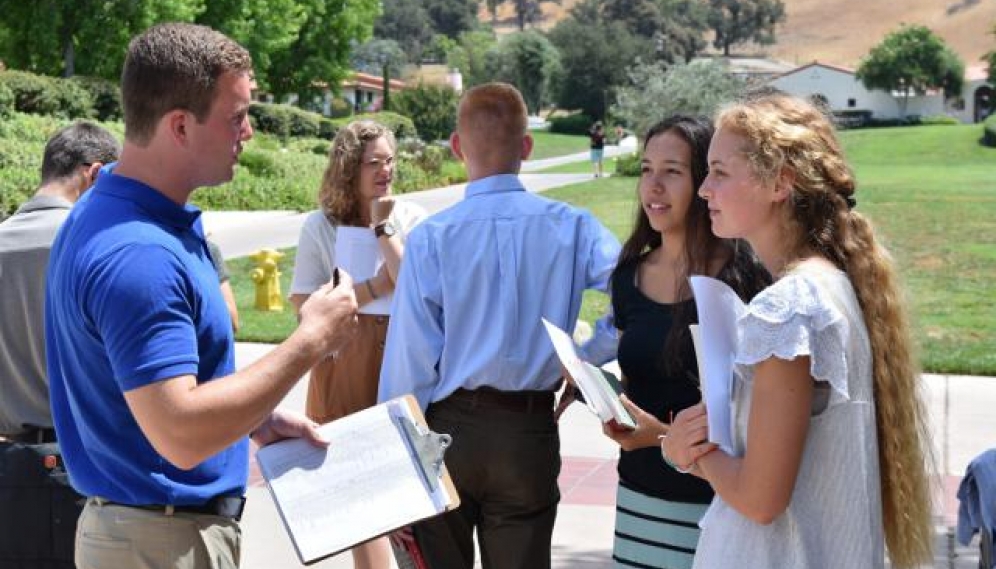 Students get their ID photos and submit t-shirt sizes (High 