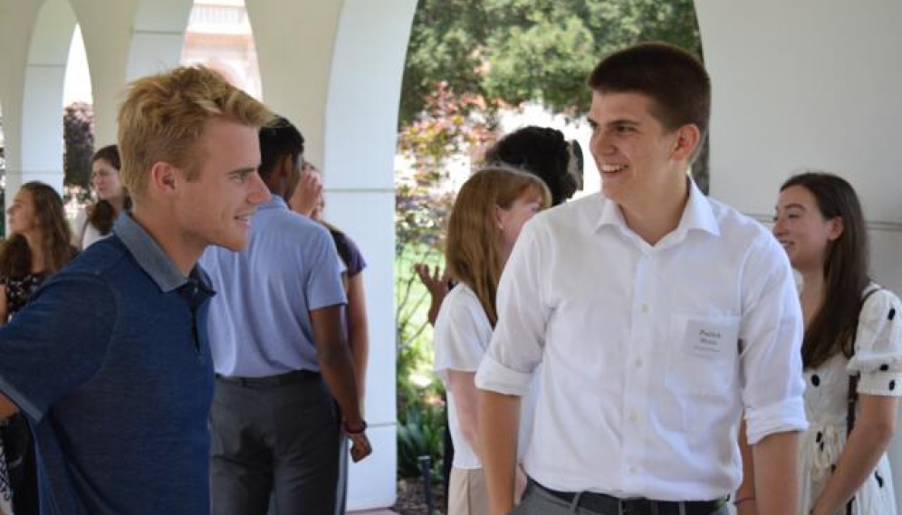 Students get their ID photos and submit t-shirt sizes (High 