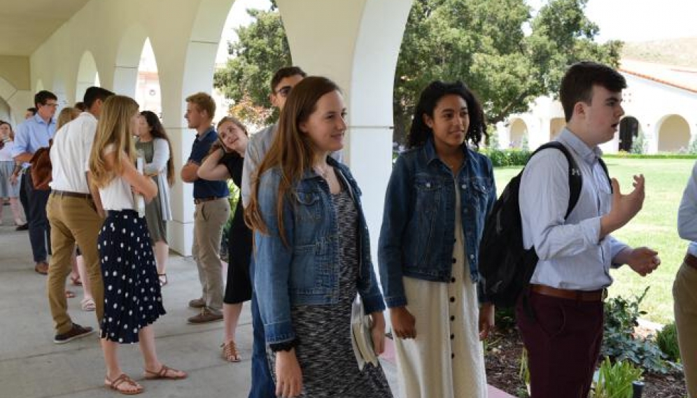 Students get their ID photos and submit t-shirt sizes (High 