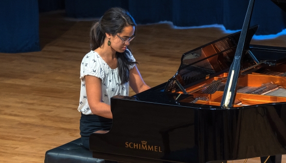 A student plays the piano