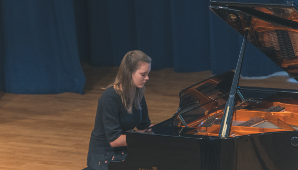 A student plays the piano