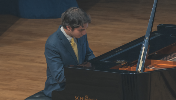 A student plays the piano