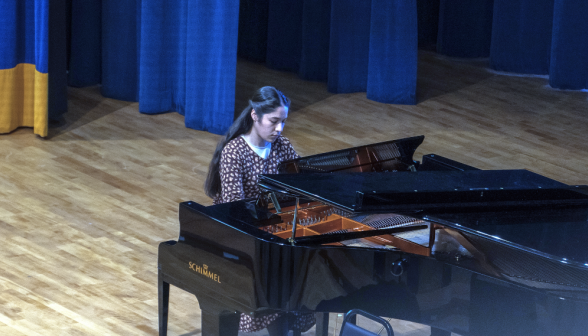 A student plays the piano