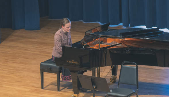 A student plays the piano