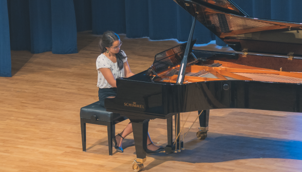 A student plays the piano