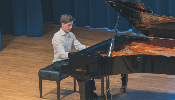 A student plays the piano