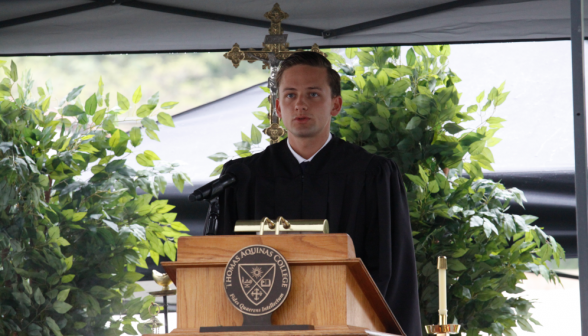 Stephey Cyr ('21), head mean's prefect, delivers the second reading