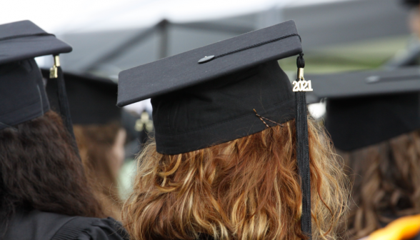 A member of the Class of 2021 watches the ceremony