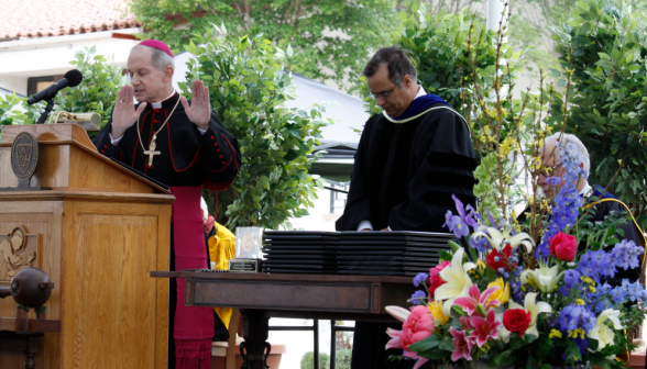 Bishop Paprocki blesses the diplomas