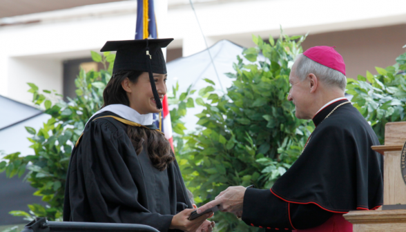 Bishop Paprocki awards the diplomas.