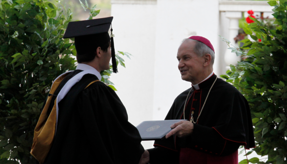 Bishop Paprocki awards the diplomas.