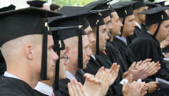 The graduates cheer each other on.