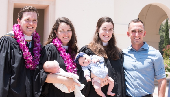 Two married couples pose with babies