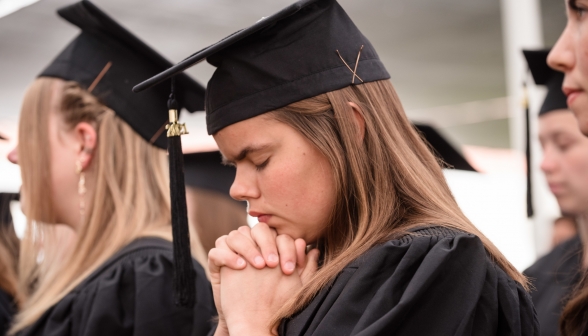 Closeup of graduates playing in the chapel