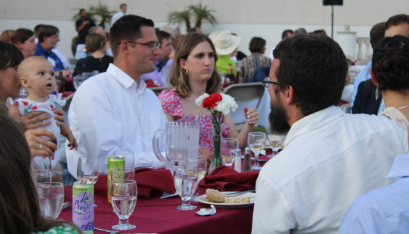 Alumni chatting around their table