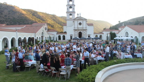 Long shot of the alumni, framed against the Chapel