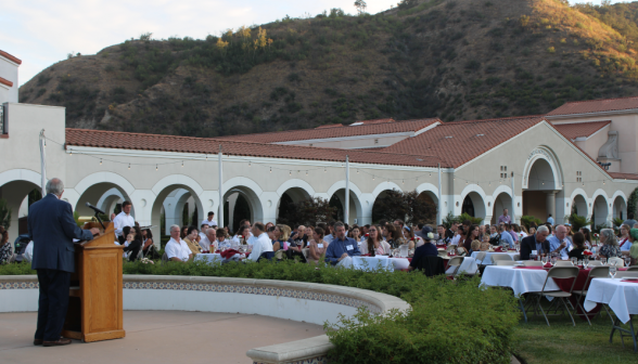 Side view of alumni being addressed