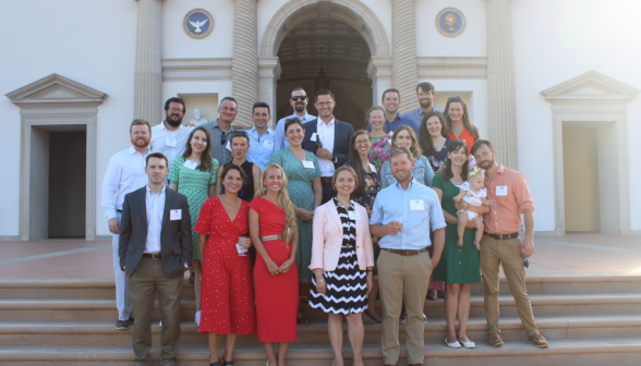 Posing for a photo on the Chapel steps, facing toward the quad