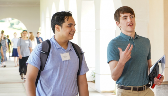 Students walk along academic quadrangle