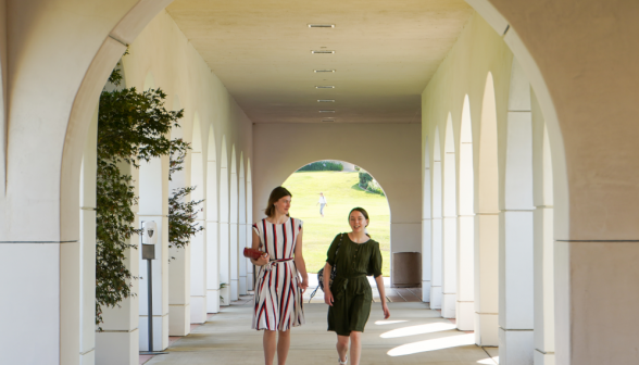 Students walk along academic quadrangle