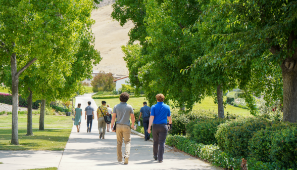 Students walk along academic quadrangle