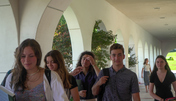 Students walk along academic quadrangle